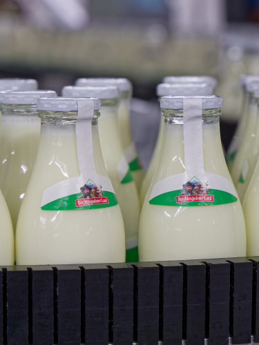 Milk bottles standing close together