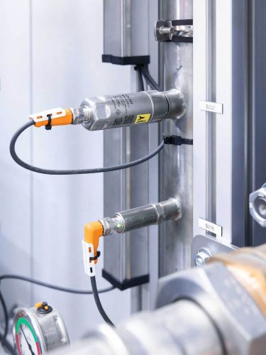 Two sensors on a coolant pipe