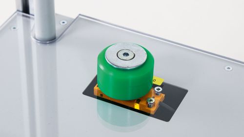 a workpiece model lies on the storage surface above an RFID read/write head