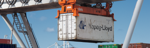 A container is attached to a spreader