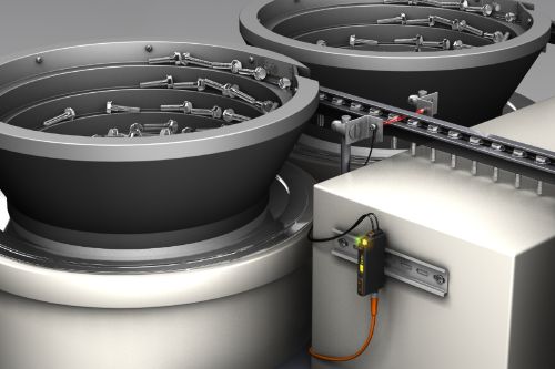 The photo shows the fibre-optic sensor on a machine for detecting small parts